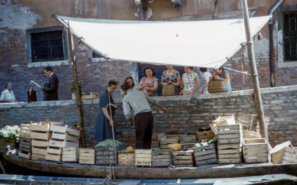 Free Image of Group of People Standing on Top of a Boat 