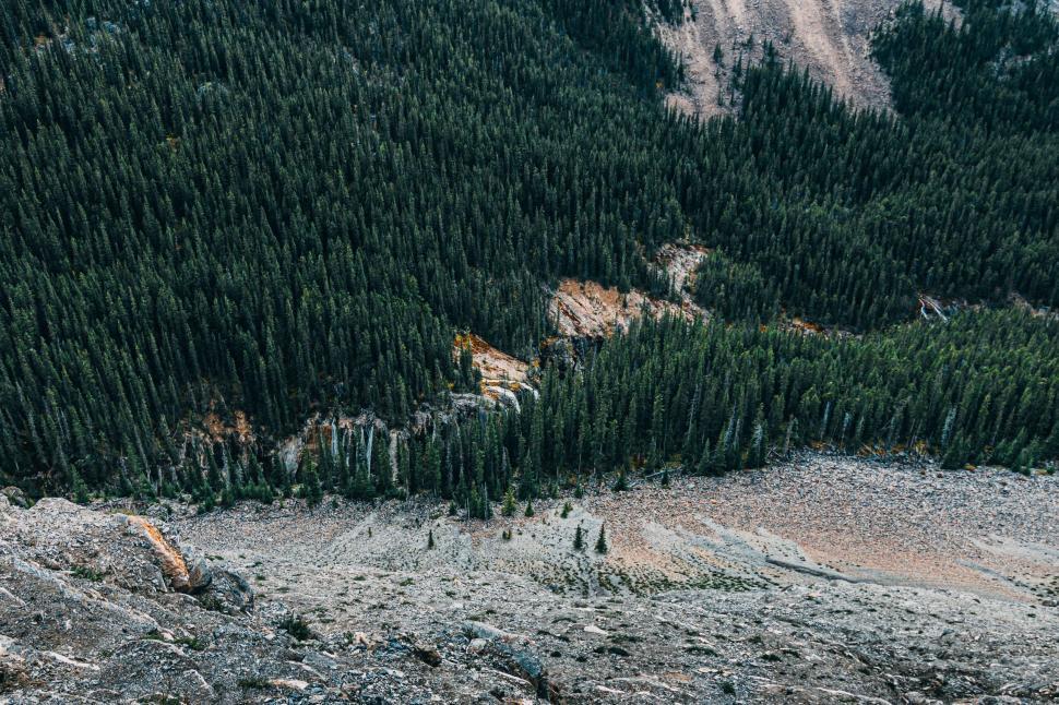 Free Image of Group of People Standing on Top of a Mountain 