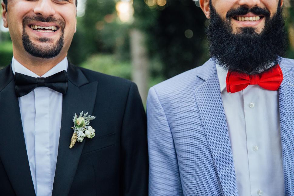 Free Image of Two Men Standing Side by Side 