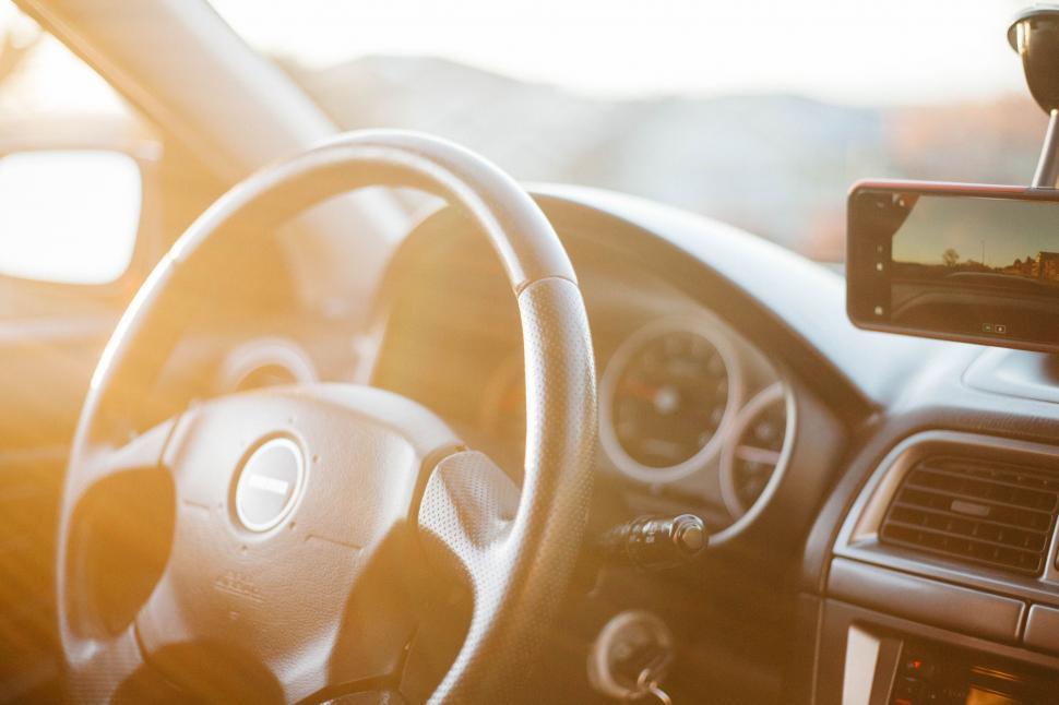 Free Image of Close Up of a Steering Wheel and Dashboard of a Car 