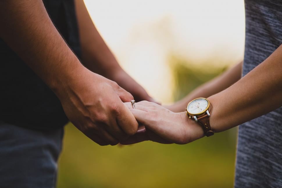 Free Image of Close Up of Two People Holding Hands 