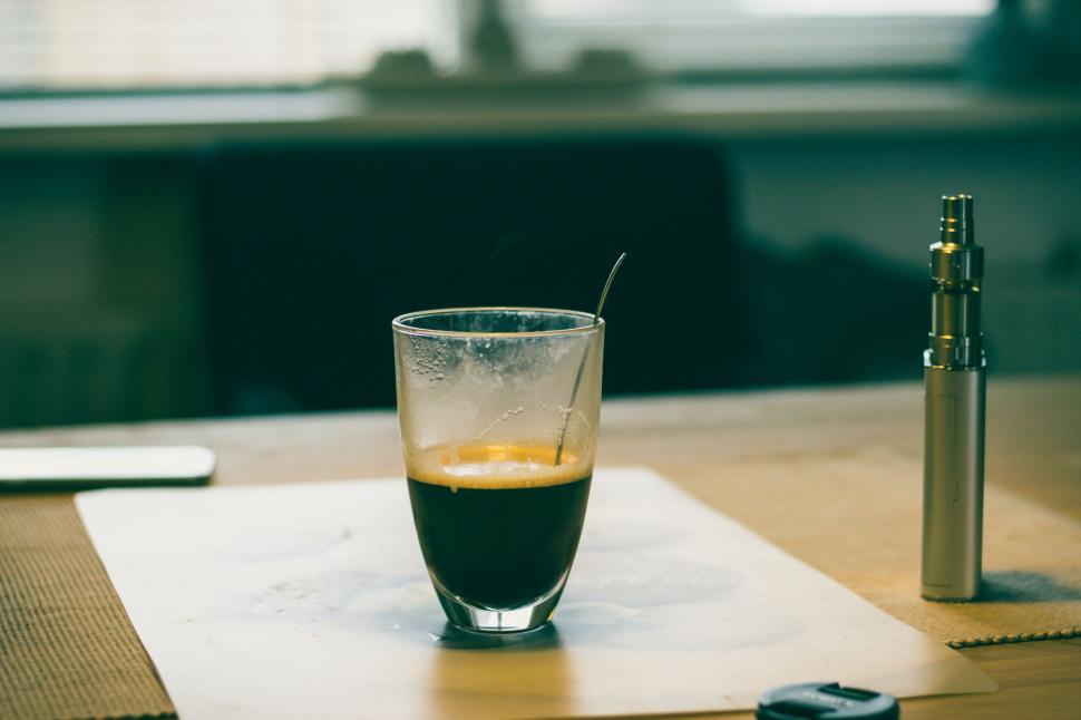 Free Image of Glass of Liquid on Wooden Table 