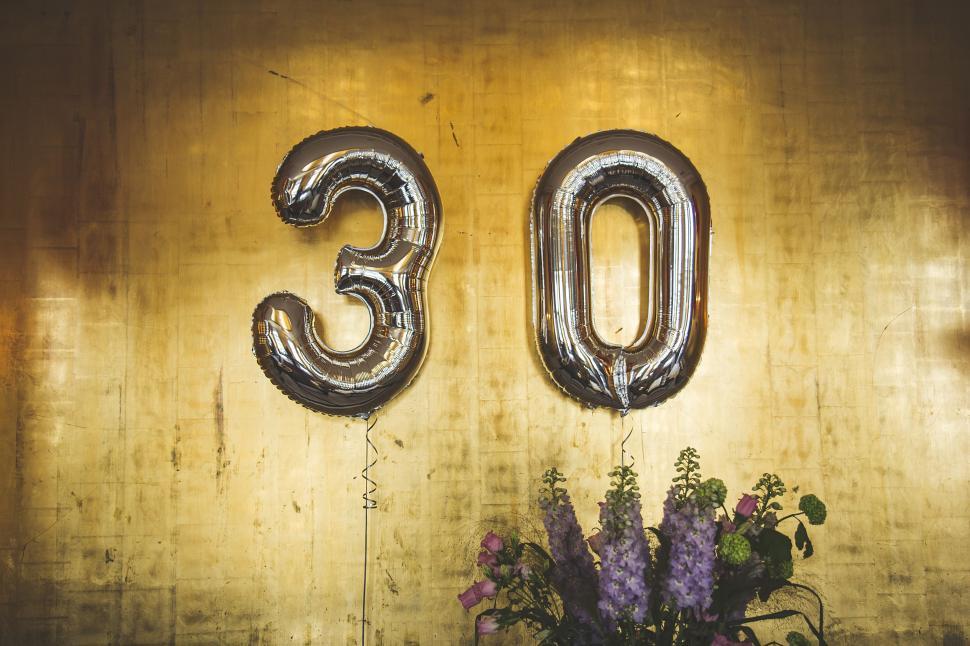 Free Image of Thirty-Three Balloons Hanging on Wall 
