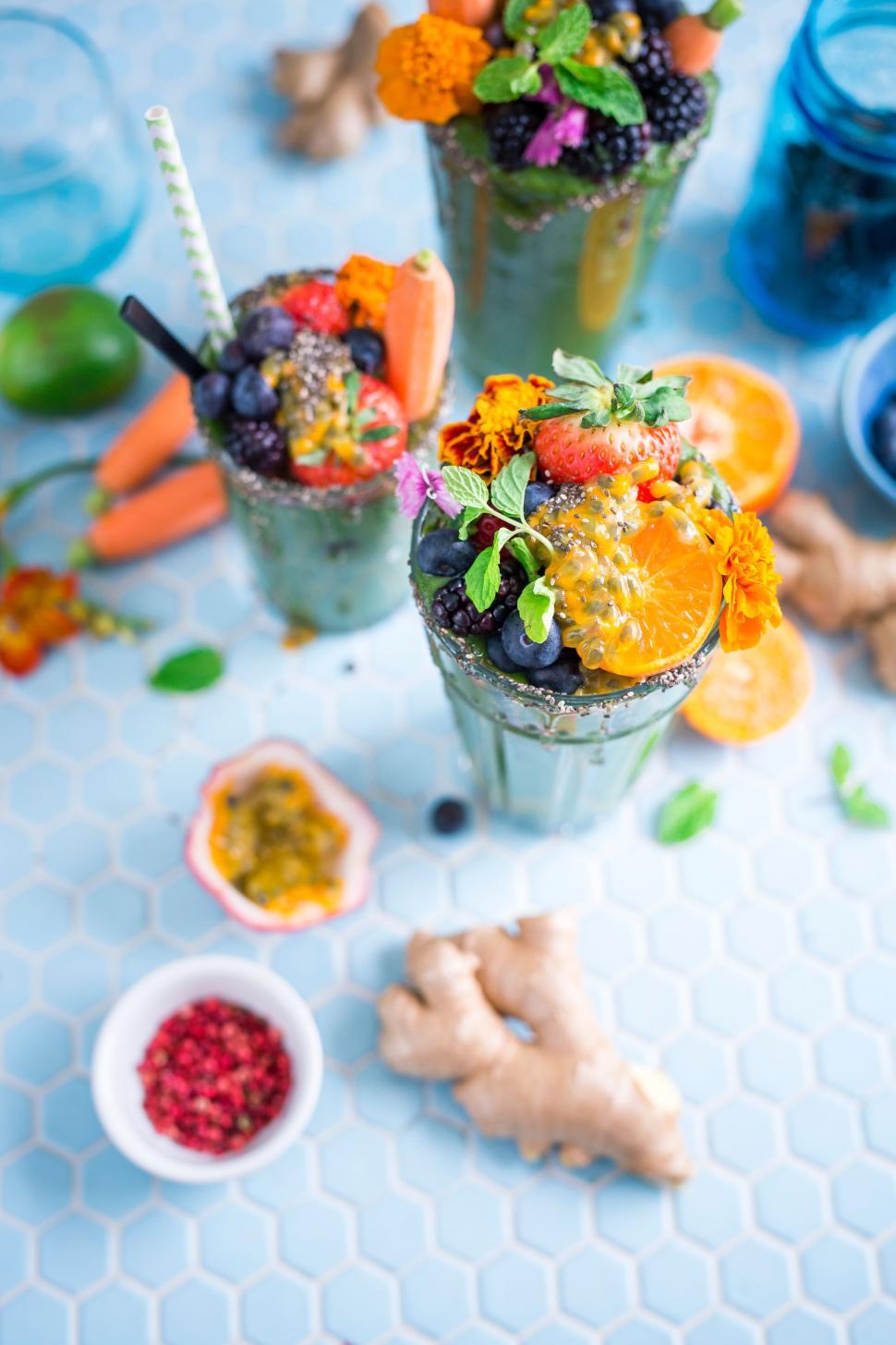 Free Image of Table With Two Cups Filled With Fruit and Veggies 