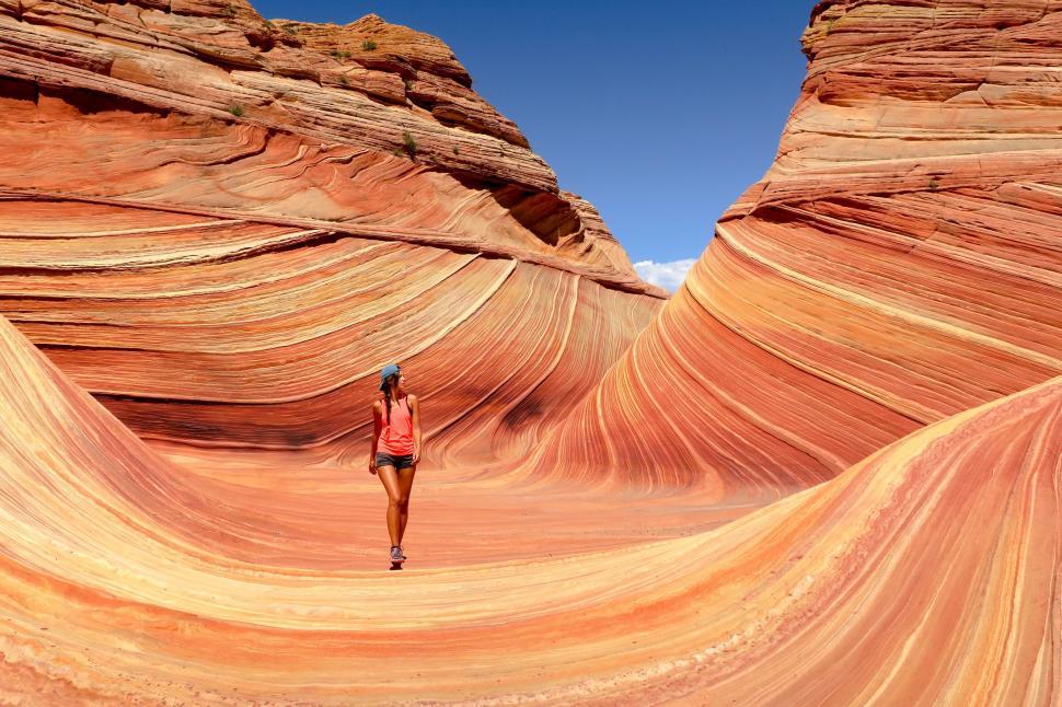 Free Image of Woman in Bikini Walking Through Desert 