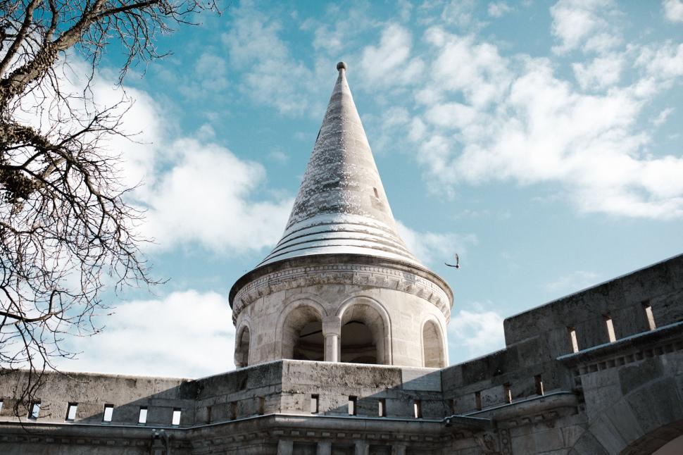 Free Image of Towering Building With Sharp Roof 