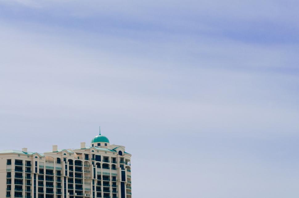 Free Image of Plane Flying Over Large Building 