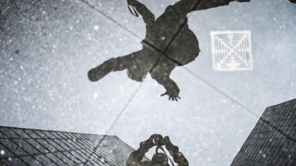 Free Image of Man Standing in Front of Tall Building 