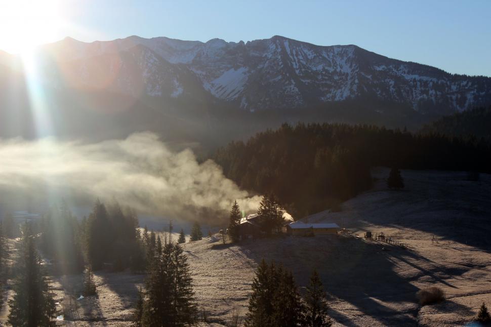Free Image of Bright Sunlight on Snowy Mountain 