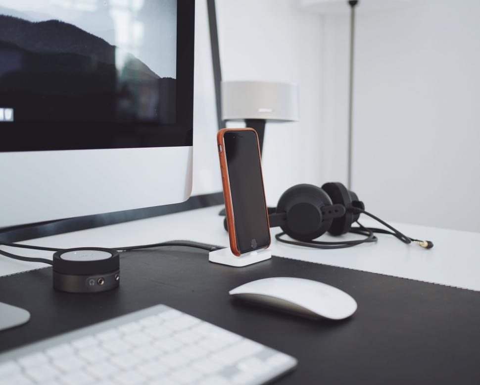 Free Image of Modern Computer Desk With Phone and Headphones 