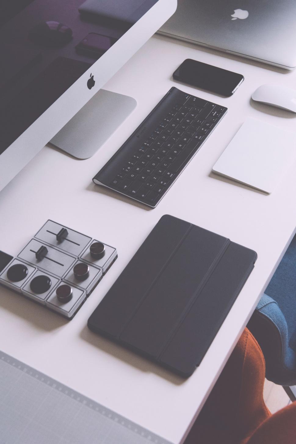 Free Image of White Table With Keyboard and Monitor 