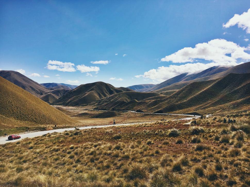 Free Image of Dirt Road Cutting Through Mountain Range 