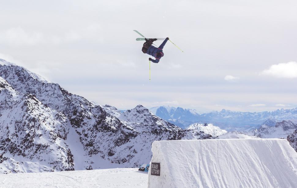 Free Image of Man Flying Through the Air on Skis 