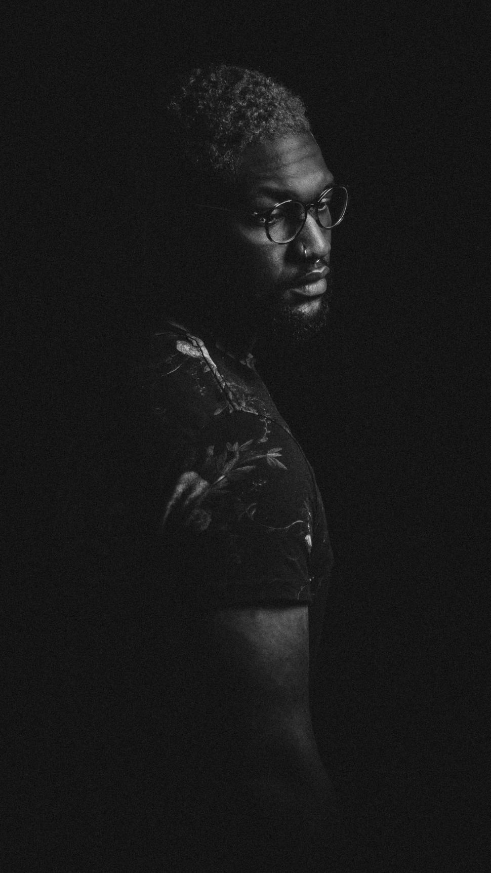 Free Image of Man With Glasses and Arm Tattoo 