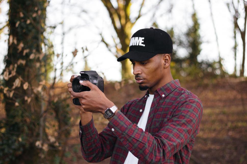 Free Image of Man Taking a Picture With a Camera 