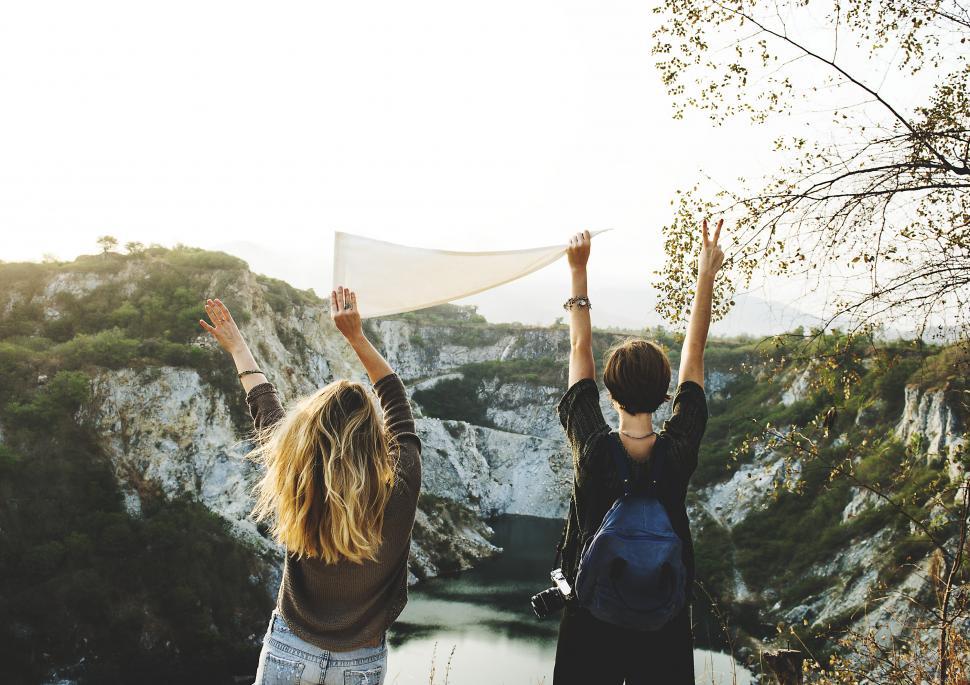 Free Image of Couple Standing on Top of a Mountain 