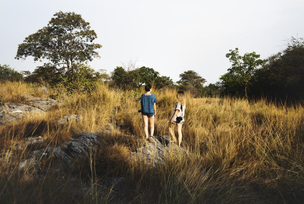 Free Image of Two People Standing in the Grass 