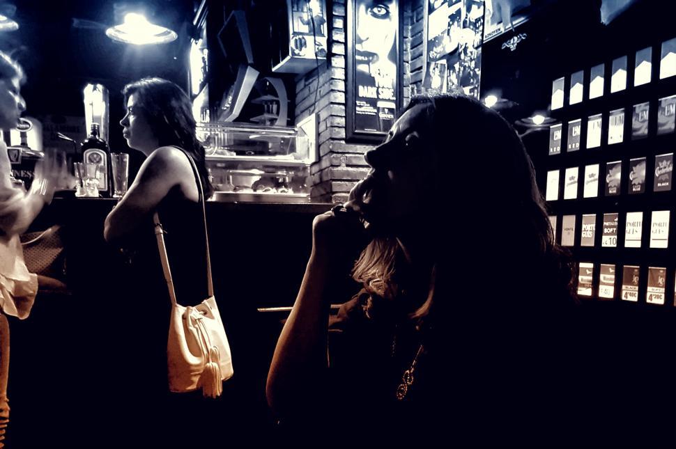 Free Image of People at a Bar - Dark Looks 