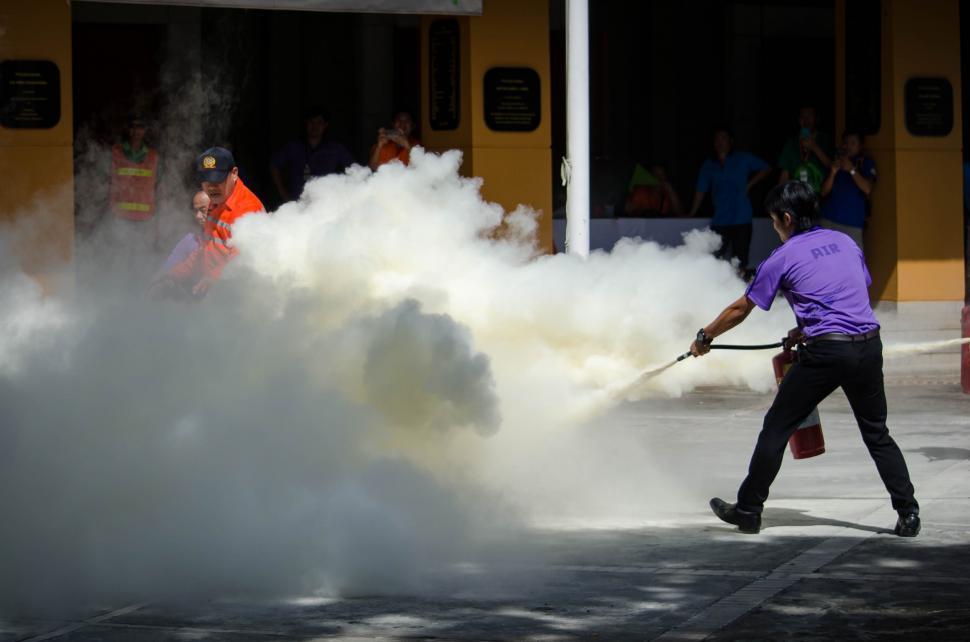 Free Image of Using a Fire extinguisher  