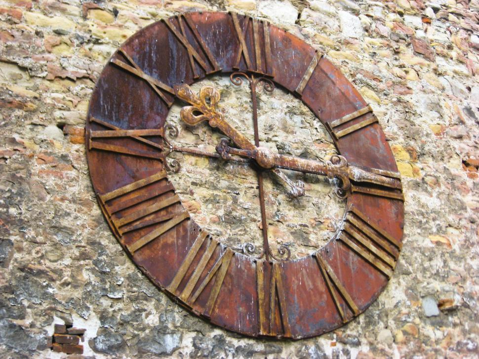 Free Image of Clock on stone wall 