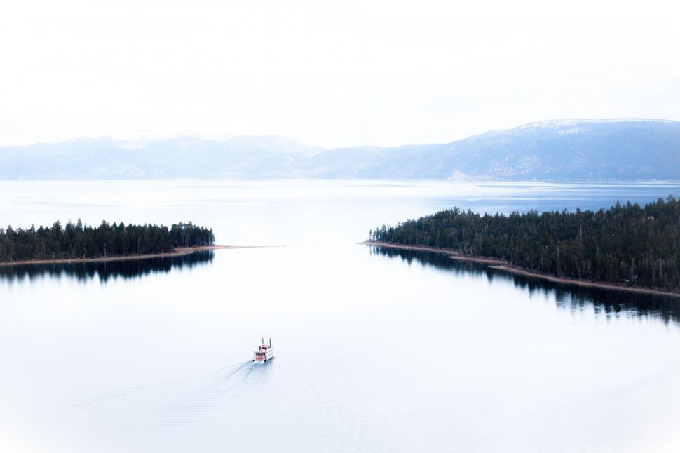Free Image of Boat Floating in Vast Ocean 