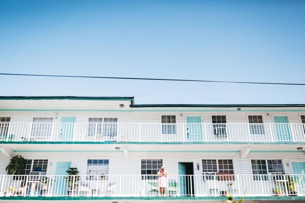Free Image of White Building With Blue and White Balcony 