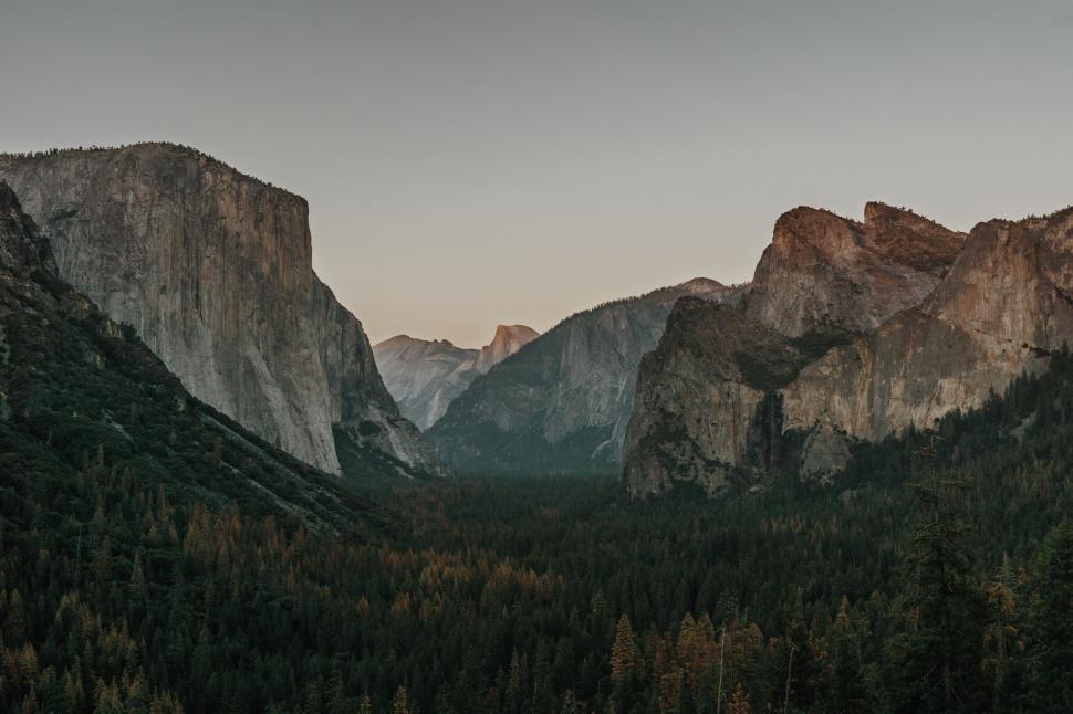 Free Image of Majestic Mountain Range With Trees in Background 