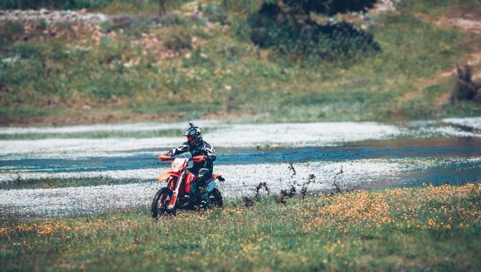 Free Image of Person Riding Motorcycle on Wet Road 