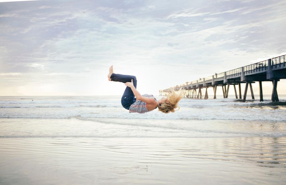 Free Image of Person Performing Handstand on Beach 