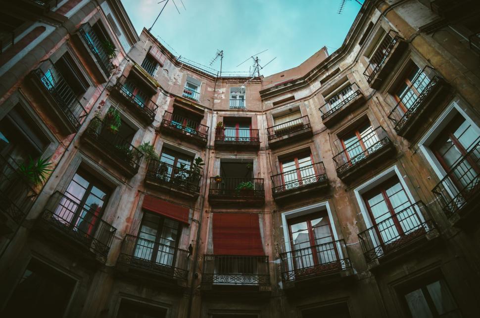 Free Image of Towering Skyscraper With Abundant Windows and Balconies 