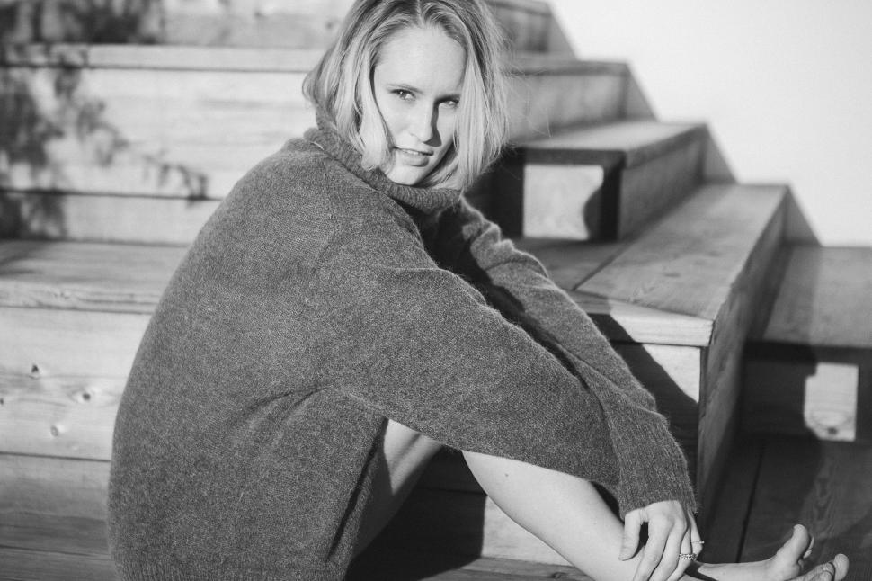 Free Image of Woman Sitting on Bench 