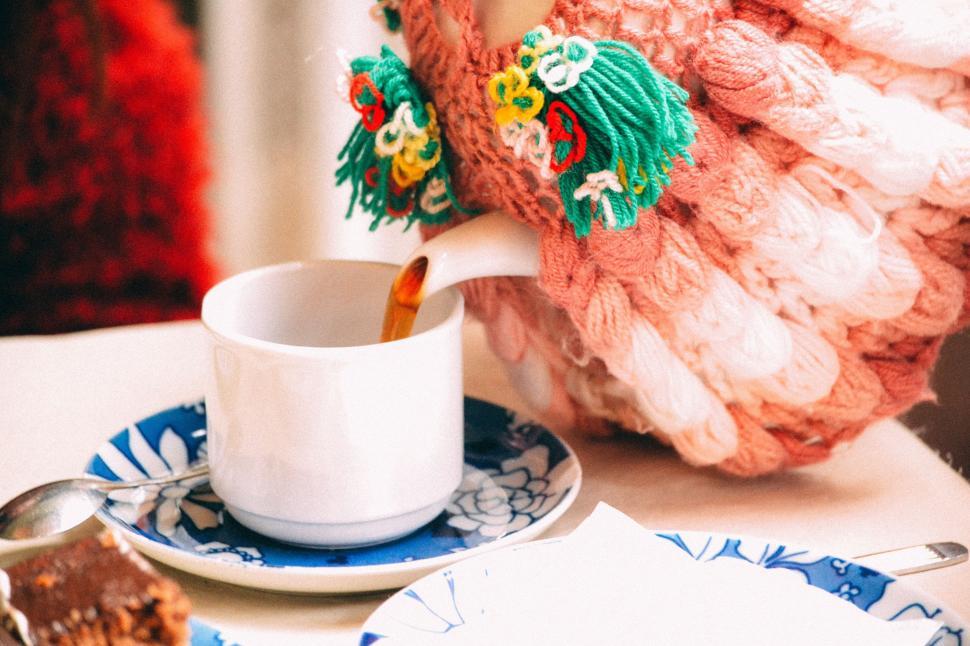 Free Image of A Cup of Coffee and a Piece of Cake on a Plate 