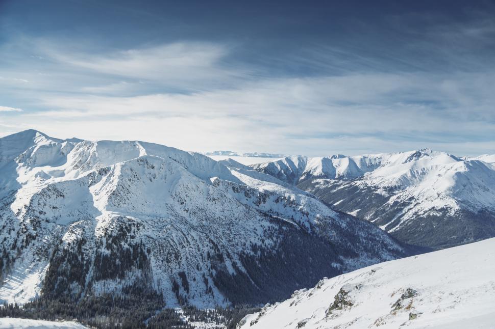 Free Image of Man Skiing Down Snow Covered Slope 