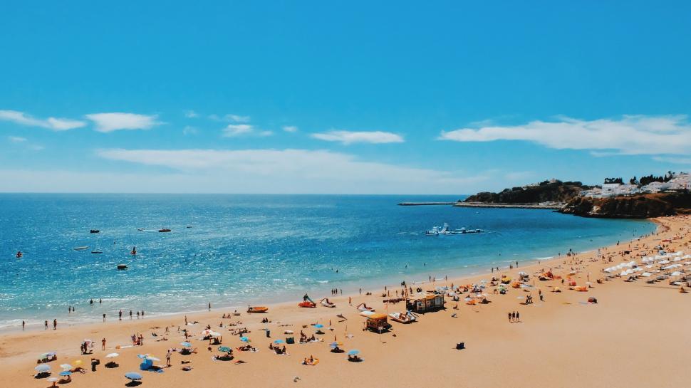 Free Image of Crowded Beach Scene on a Sunny Day 