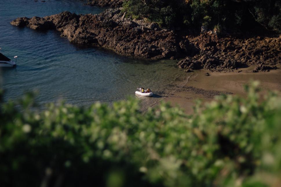 Free Image of Small Boat Floating on Body of Water 