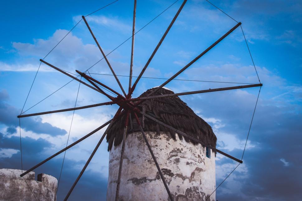 Free Image of Large White and Black Windmill on a Cloudy Day 
