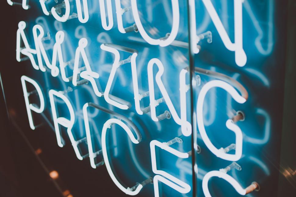 Free Image of Neon Sign Mounted on the Side of a Building 
