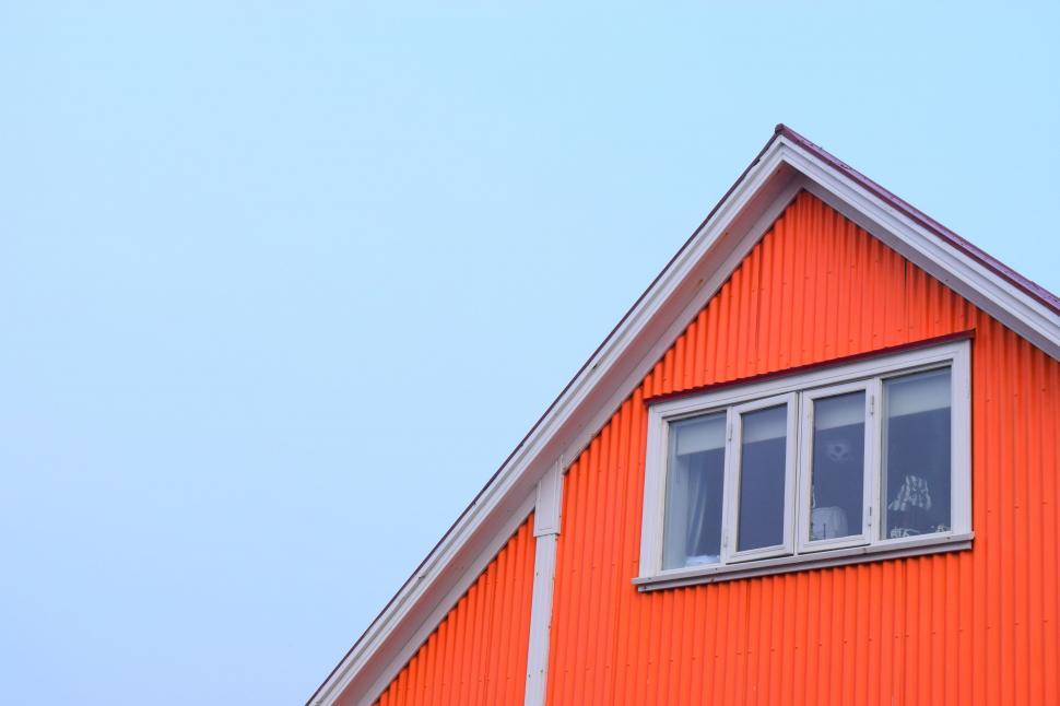 Free Image of Red Building With Clock on Side 