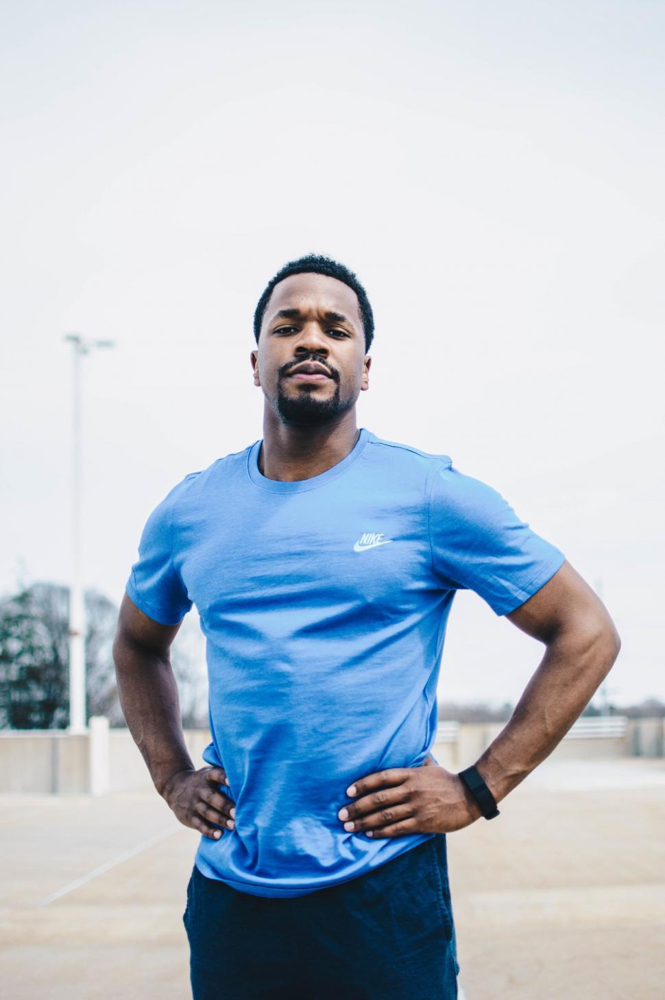 Free Image of Man Standing With Hands on Hips 