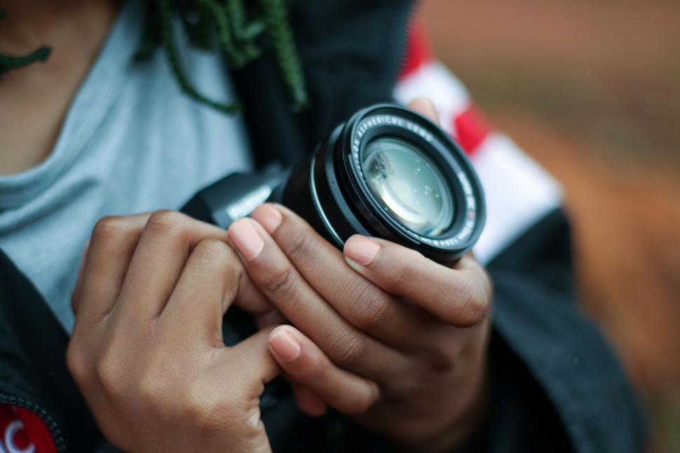 Free Image of Person Holding Camera in Hands 