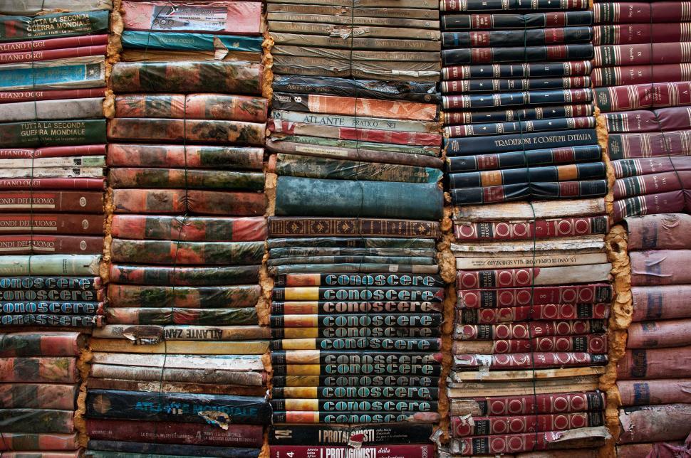 Free Image of A Pile of Books Sitting Next to Each Other 