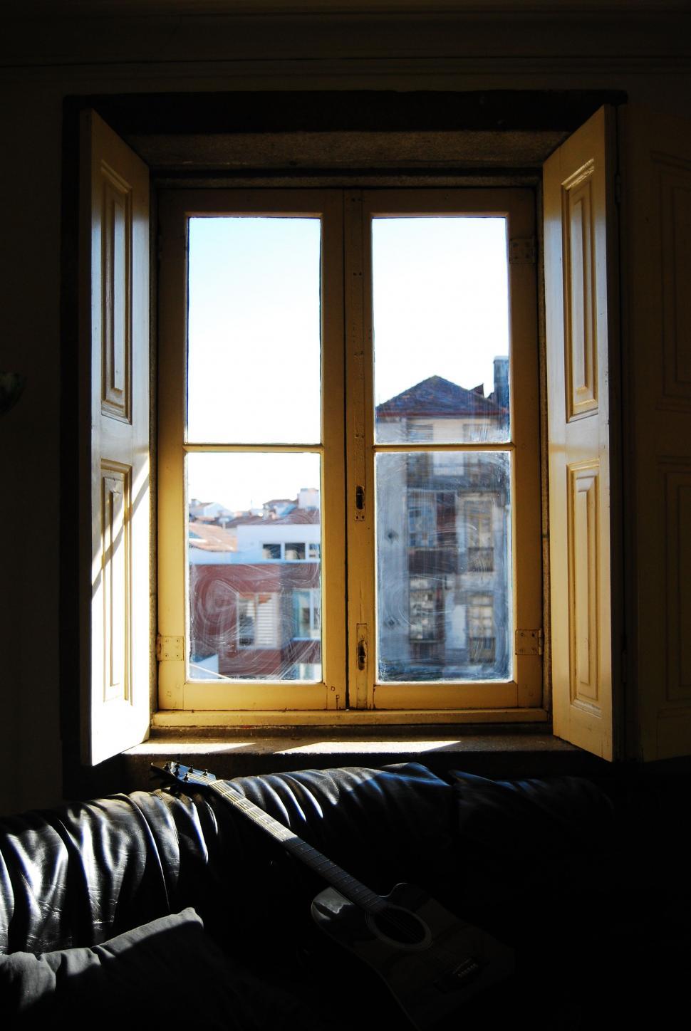 Free Image of Leather Couch in Front of Window 