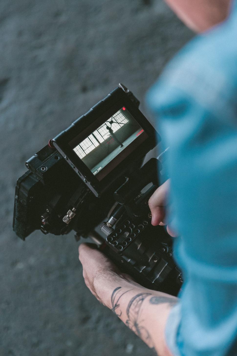 Free Image of Person Holding Camera 