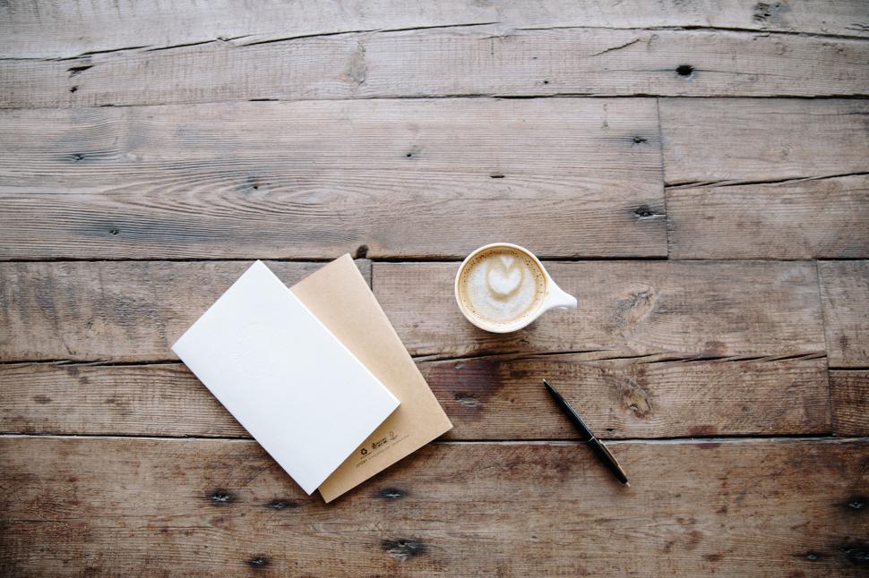 Free Image of A Cup of Coffee on Wooden Table 