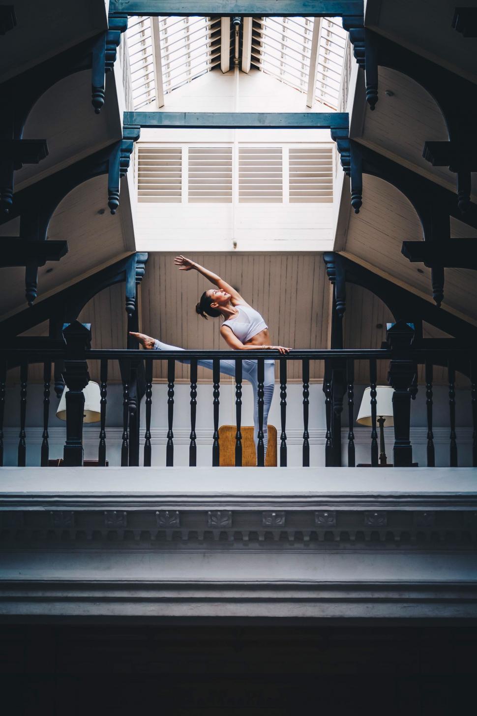 Free Image of Woman Standing on Staircase in Building 