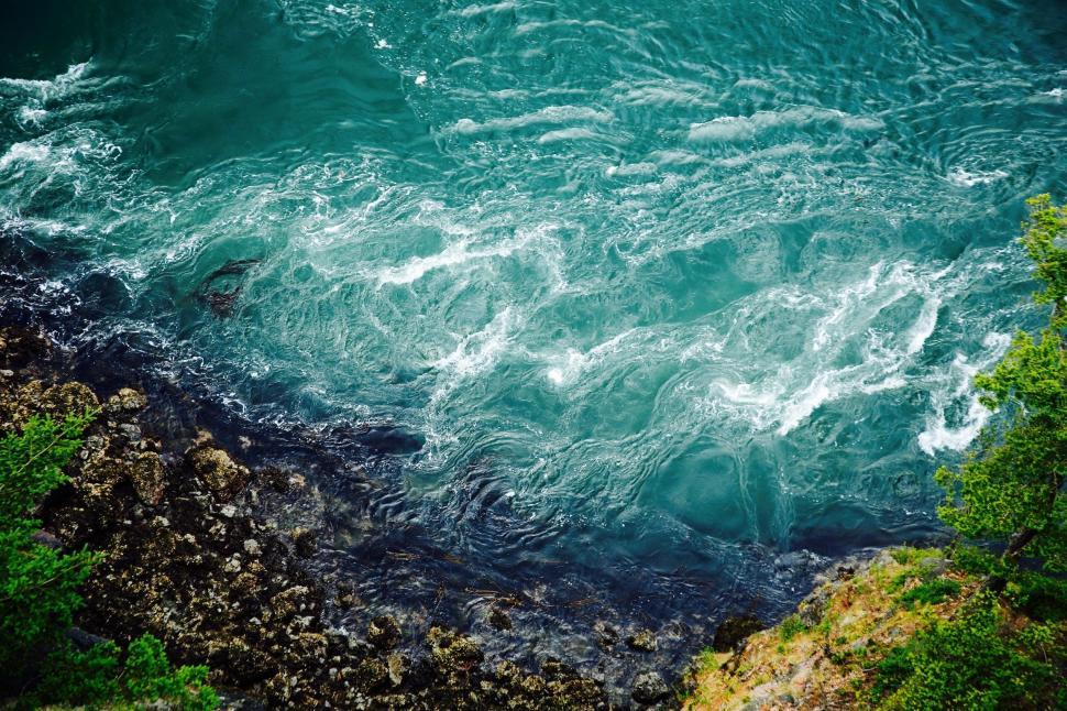 Free Image of Water Body Surrounded by Trees and Rocks 