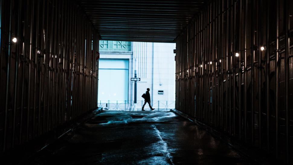 Free Image of Man Walking Down Dark Alley Way 