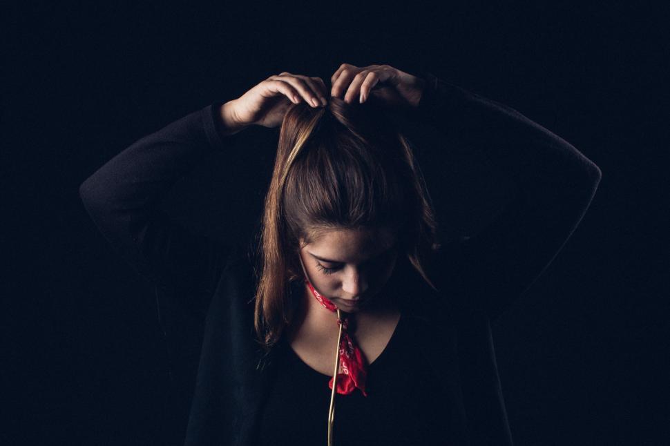 Free Image of Woman With Hands on Head 