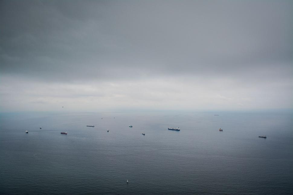 Free Image of Group of Boats Floating on Large Body of Water 