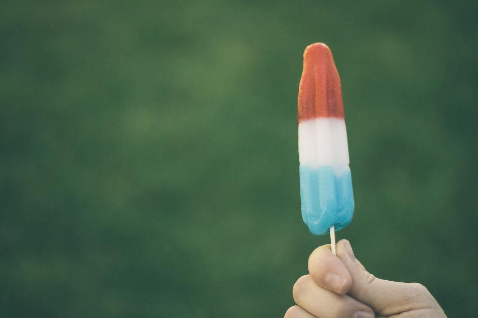 Free Image of Person Holding a Candy Bar 